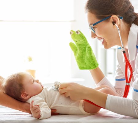 doctor examining a baby in a hospital